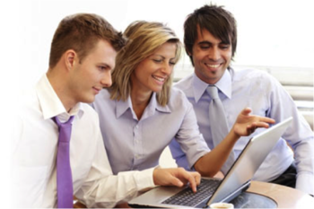 Three people looking at computer
